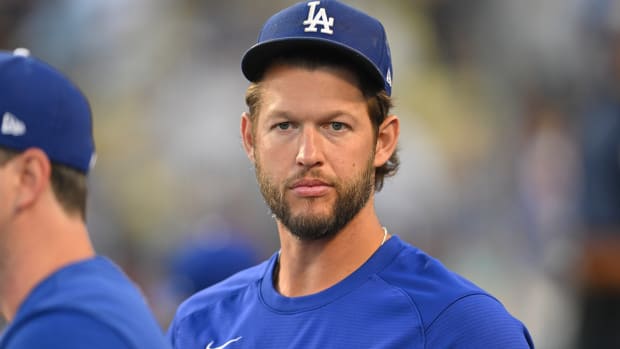 Jul 25, 2022; Los Angeles, California, USA; Los Angeles Dodgers starting pitcher Clayton Kershaw (22) looks on from the dugout against the Washington Nationals at Dodger Stadium. Mandatory Credit: Jayne Kamin-Oncea-USA TODAY Sports